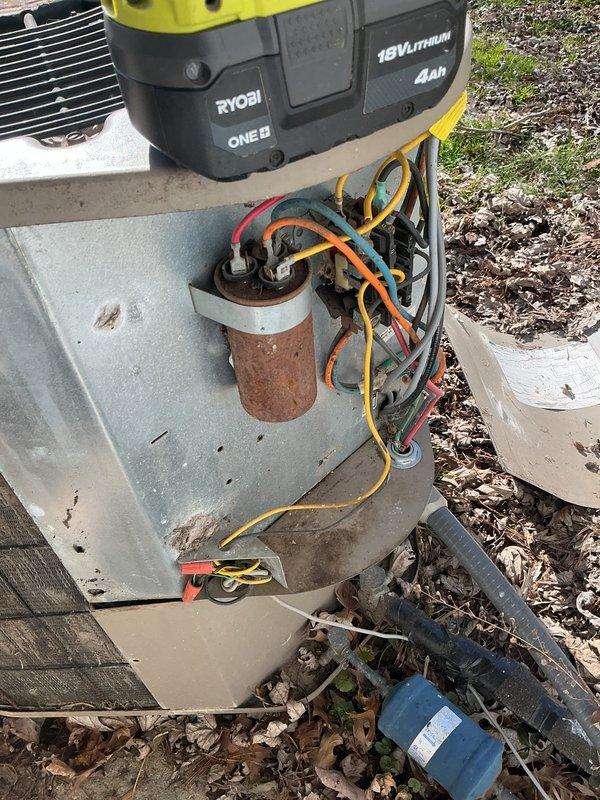 Performed comprehensive heating system tune-up on aging outdoor unit prior to home sale. Accessed internal components to inspect electrical connections, noting significant rust on capacitor. Completed necessary maintenance while documenting system condition with photos for service record.