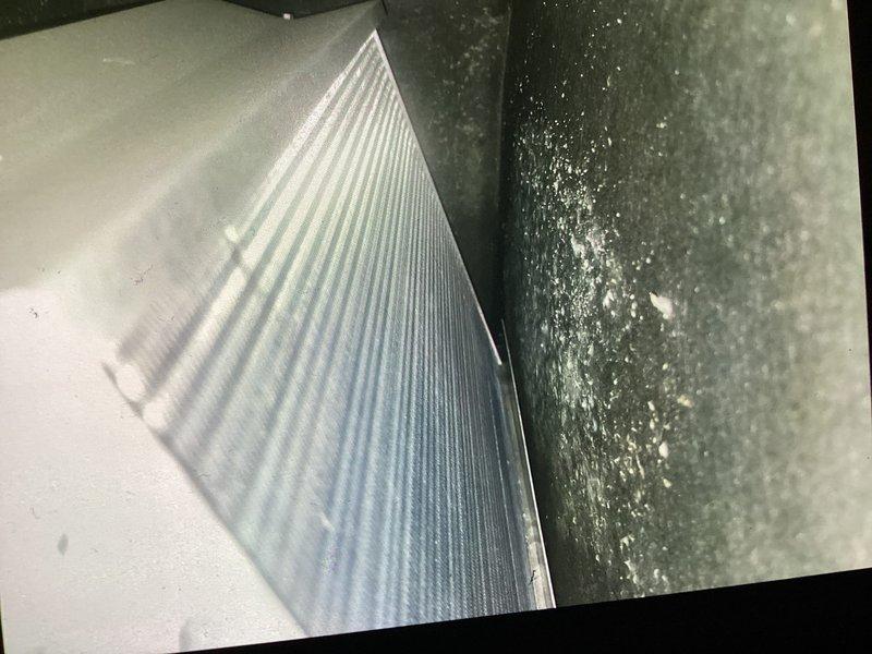 Performed annual heating system maintenance on unit with expired CCH agreement (payment due). Inspected blower wheel assembly which showed moderate dust accumulation on blades. Replaced 14x14x1 air filter and documented condition of heat exchanger components. System is now operating within normal parameters.