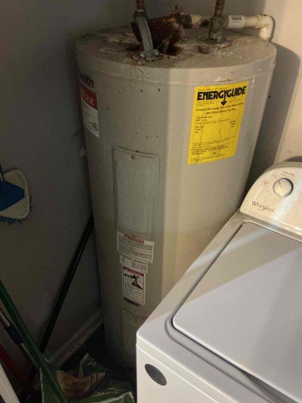 Responded to service call for slow-draining shower/tub. Diagnosed and cleared clogged drain using professional equipment, restoring proper drainage function. Inspected water heater system during visit and noted signs of aging/corrosion around pipe connections that may require future attention.