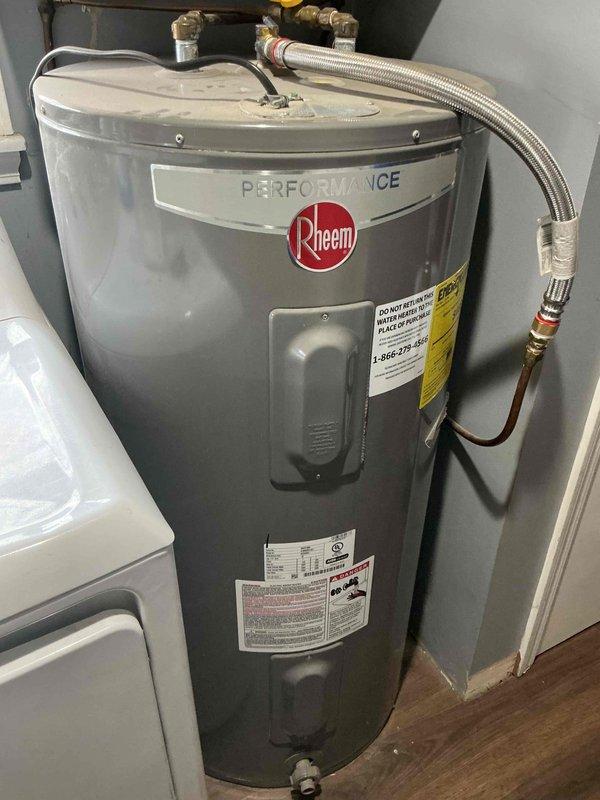 Performed inspection on Rheem Performance tanked water heater. Verified proper installation of copper and brass plumbing connections, checked pressure relief valve functionality, and confirmed no visible leaks, damage, or rust present on the unit. System is operating within normal parameters with all connections secure.