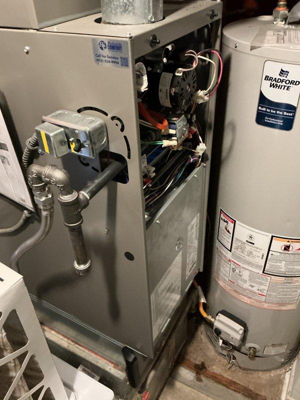 Completed monthly maintenance service on residential heating system, which included inspection of the furnace internals (motor, wiring, and electrical connections) and verification of thermostat functionality (confirmed proper operation at 72°F in Heat mode with Fan Auto setting). System appears to be functioning normally with no issues identified.