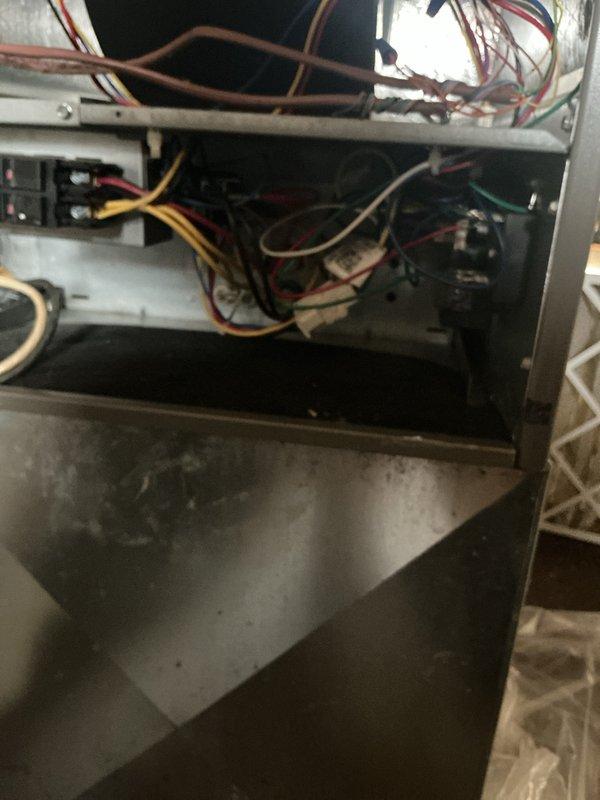 Performed annual heating system maintenance on CCHP unit. Inspected and tested electrical connections, including multi-colored wire harnesses and circuit connections. Conducted diagnostic testing with multimeter to verify proper system operation, with renewal service scheduled through 5/18/26.