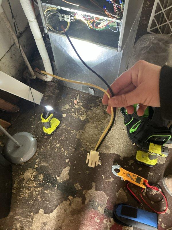 Performed annual heating system maintenance on CCHP unit. Inspected and tested electrical connections, including multi-colored wire harnesses and circuit connections. Conducted diagnostic testing with multimeter to verify proper system operation, with renewal service scheduled through 5/18/26.