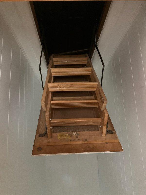 Conducted inspection of R22 system with 1984 air handler and 2014 condensing unit. System is currently low on refrigerant but not in immediate use. Provided comprehensive replacement options as requested by customer who plans to upgrade within one month. Accessed equipment through attic pull-down ladder which appears in good functional condition.