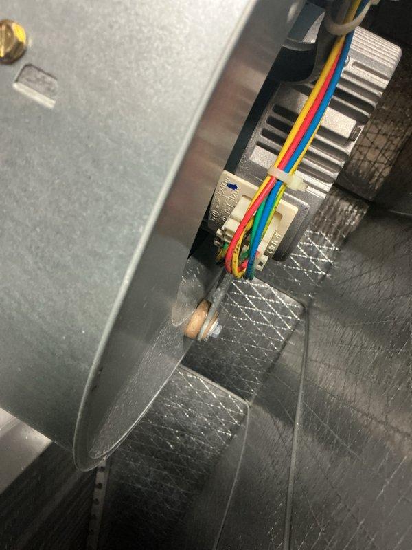 Performed routine maintenance on Carrier HVAC system. Inspected electrical connections and wiring at control module, confirming proper terminal connections of control wires (red, yellow, green, and blue). Verified thermostat operation, which was functioning correctly in heat mode with room temperature at 66° and set point at 70°.