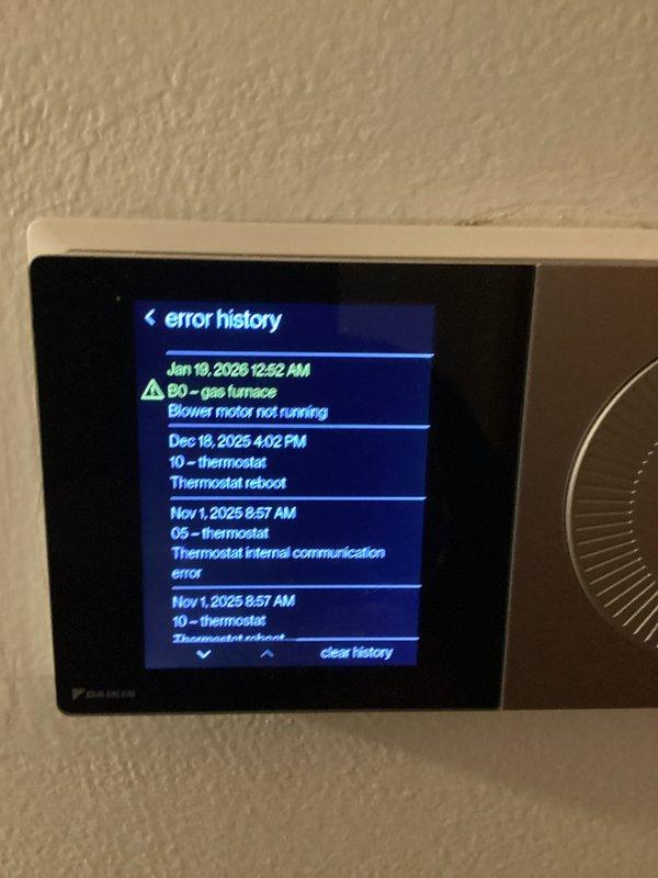 Performed basic monthly maintenance service on customer's heating system. Inspected Daikin thermostat which showed error history including gas furnace blower motor issues and thermostat communication errors. Noted A.O. Smith water heater and water softener system in utility room during inspection. Filter replacement (20x25x4) not included in service.