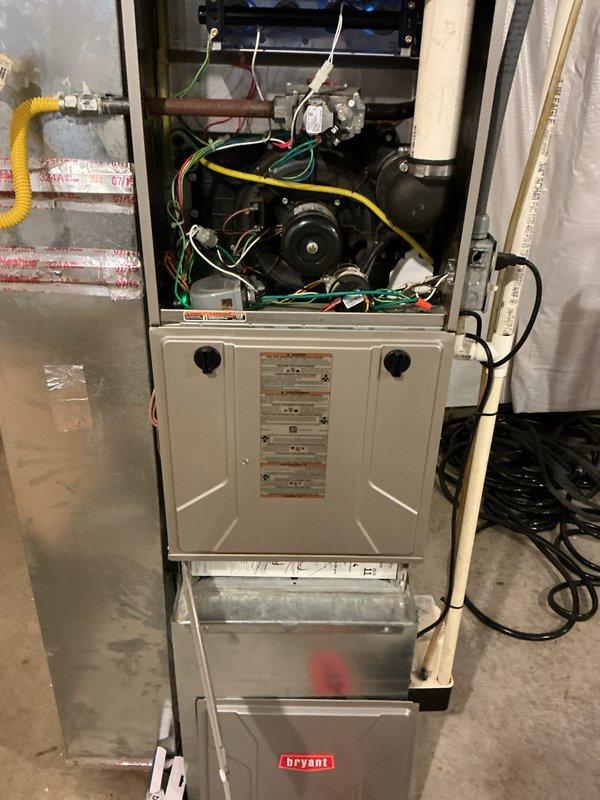 Performed basic monthly heating maintenance on Bryant furnace system, including inspection of blower motor, electrical connections, and gas line. Noted the water heater installation showing possible moisture at base, requiring future monitoring. All components functioning properly with filter replacement (16x25x4) not included in this service visit.