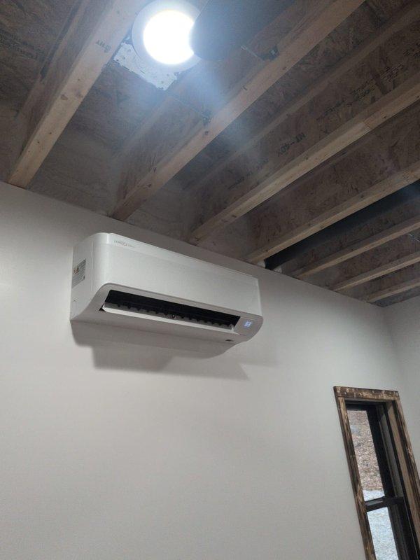 Completed inspection of mini-split system installed on interior wall; documented that CCH - Geos Membership information is unclear and filter information not documented. Verified operation of remote control (Lennox brand) and noted that installation area has unfinished ceiling with exposed joists requiring attention for optimal system performance.