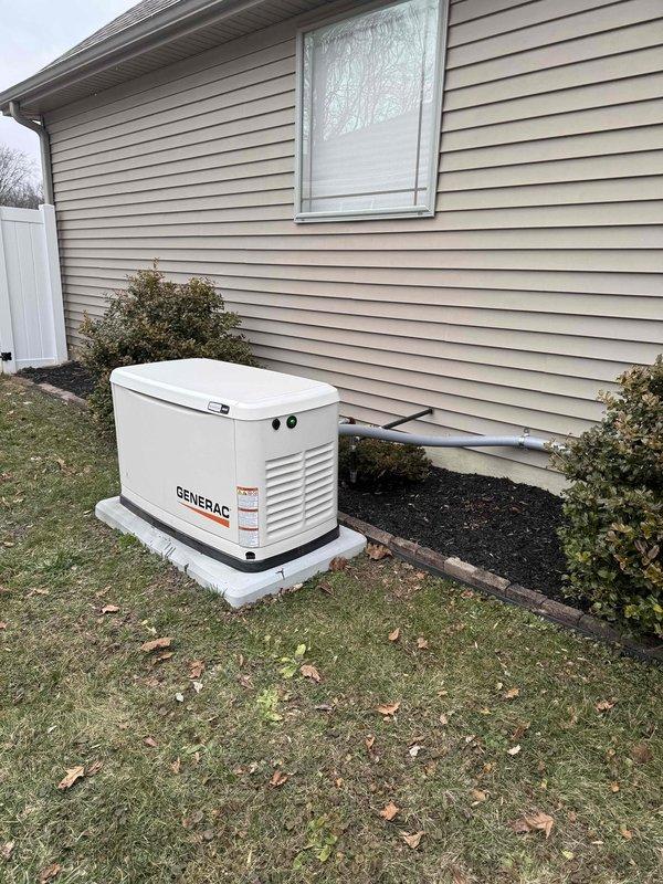 Performed complimentary annual maintenance on Generac residential backup generator (Model# G00722810, Serial# 3016471879, 120/240V, 60HZ, 3,600 RPM). Inspected exterior unit, transfer switch, and electrical connections; all components were found to be in good working condition with proper installation on concrete pad and appropriate conduit connections to the residence.