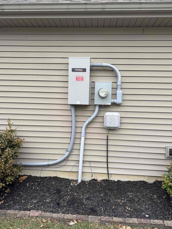 Performed complimentary annual maintenance on Generac residential backup generator (Model# G00722810, Serial# 3016471879, 120/240V, 60HZ, 3,600 RPM). Inspected exterior unit, transfer switch, and electrical connections; all components were found to be in good working condition with proper installation on concrete pad and appropriate conduit connections to the residence.