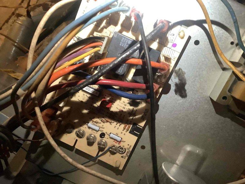 Performed OEM blower motor repair on HVAC system. Accessed control board (ST916081094) with visible dust accumulation and inspected wiring connections to the motor. Completed necessary repairs to restore proper system operation.