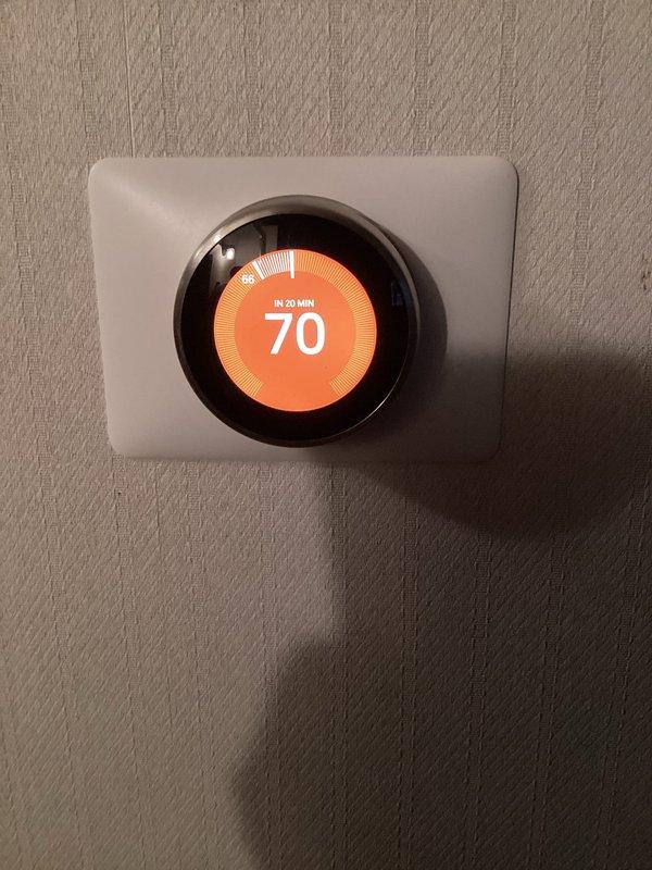 Responded to service call regarding heating system not maintaining set temperature. Inspected programmable thermostat which was correctly set to 70°F but showing scheduled temperature change. Examined furnace unit and connections, confirmed proper operation. Adjusted thermostat programming to maintain consistent temperature without scheduled setbacks, resolving the 5-degree temperature differential issue.