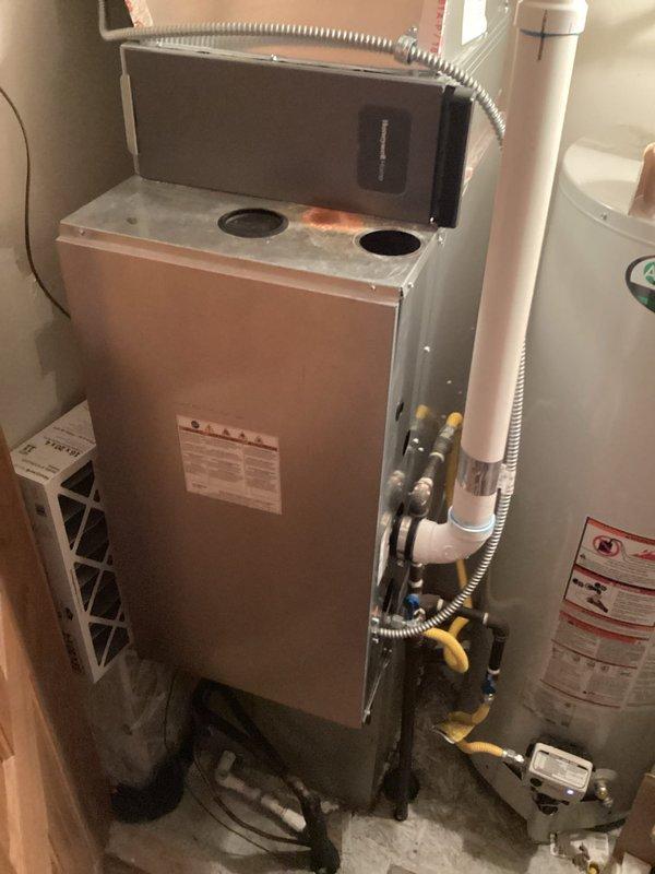 Responded to service call regarding heating system not maintaining set temperature. Inspected programmable thermostat which was correctly set to 70°F but showing scheduled temperature change. Examined furnace unit and connections, confirmed proper operation. Adjusted thermostat programming to maintain consistent temperature without scheduled setbacks, resolving the 5-degree temperature differential issue.