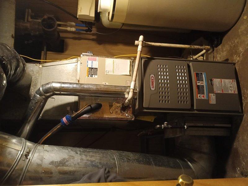 Successfully installed a new Lennox 80% efficiency gas furnace with proper ductwork connections and ventilation system. Verified system temperatures with digital measurement tools and ensured all components were functioning according to manufacturer specifications. Complete installation includes properly sized return air system with 16x20x1 filter configuration.