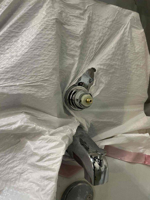 Performed follow-up service call regarding insufficient hot water in shower after recent valve replacement. Inspected installation and discovered temperature limiting feature was activated on the new valve. Adjusted maximum temperature setting on the valve assembly and confirmed proper hot water flow. Shower now functioning correctly with adequate hot water temperature.