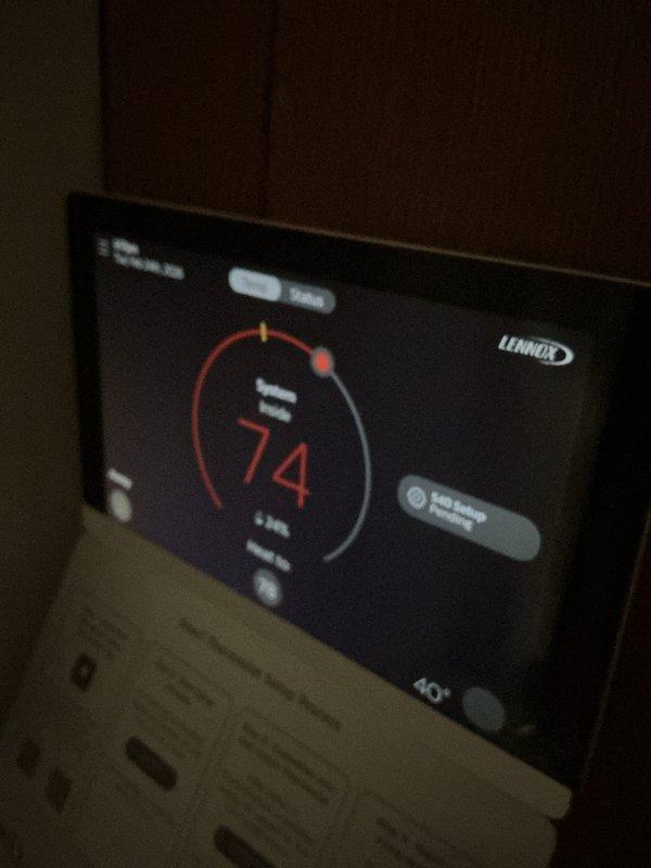 Performed scheduled cooling maintenance service on a residential Lennox HVAC system. Inspected outdoor condensing unit which appeared in good condition with proper clearance and intact refrigerant lines. Verified thermostat was operating correctly, displaying 74 degrees and responding to system commands.