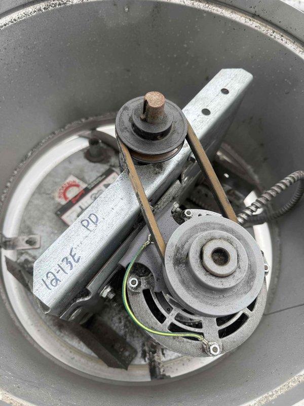 Diagnosed and repaired overheating exhaust fan motor located on roof that had fried wiring. Inspected belt drive system and mounting components, documenting condition with photos of motor assembly and mechanical components. Replaced damaged wiring to restore proper functionality to the ventilation system.