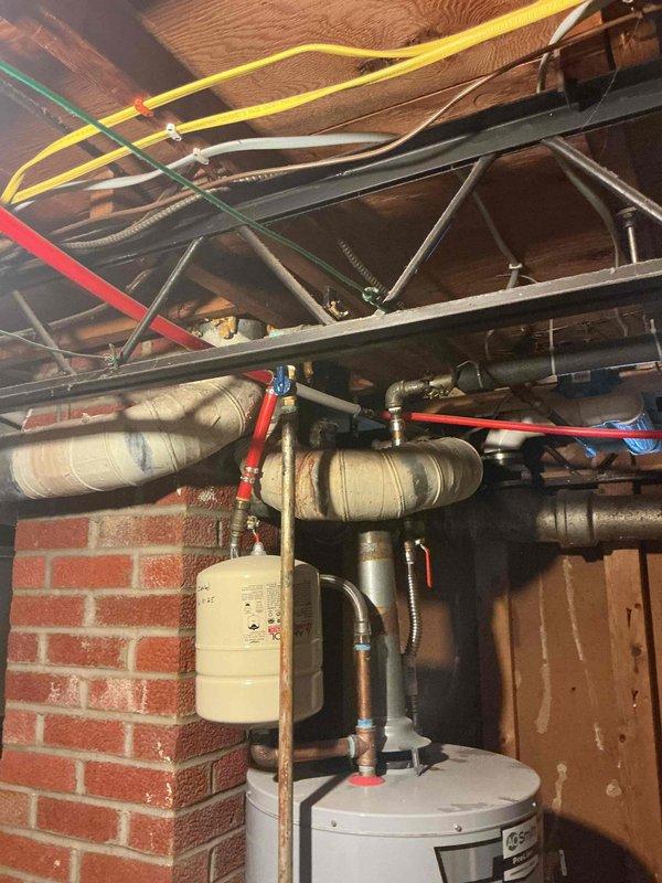 Completed monthly prepaid plumbing inspection of residential water heater system and associated plumbing infrastructure. Visually inspected water heater, expansion tank, supply lines, PEX tubing connections, and insulated pipes for signs of leaks, corrosion, or damage - all components found to be in proper working condition with no issues requiring immediate attention.