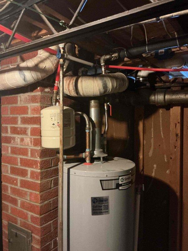 Completed monthly prepaid plumbing inspection of residential water heater system and associated plumbing infrastructure. Visually inspected water heater, expansion tank, supply lines, PEX tubing connections, and insulated pipes for signs of leaks, corrosion, or damage - all components found to be in proper working condition with no issues requiring immediate attention.