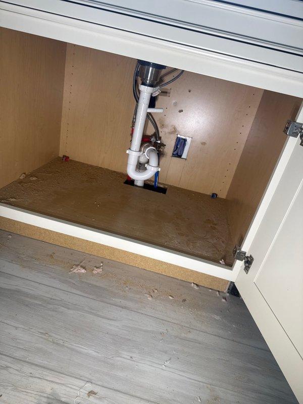 Completed final plumbing connections for new construction project including installation of kitchen sink drain assembly, dishwasher supply line, and shower fixture set with rainfall shower head. Inspected and verified proper operation of sewer pump per owner's request, and completed all required fixture connections for marble-patterned shower surround installation.