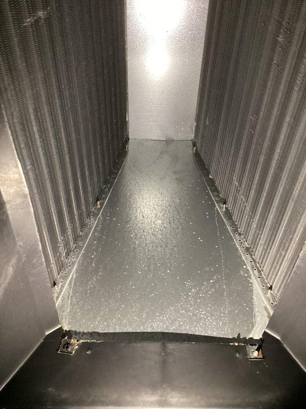 Performed monthly basic heating maintenance service with focus on system inspection. Observed condensation on evaporator coil surfaces indicating normal operation, and verified thermostat functionality with proper display readings and temperature control capabilities at 90°F setpoint. System currently operating within expected parameters.