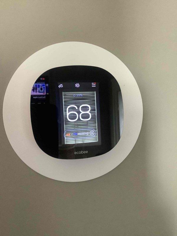 Performed diagnostic assessment on 10-15 year old furnace system experiencing intermittent heating issues. Inspected outdoor heat pump unit which appeared in good condition with no visible damage. Verified Ecobee thermostat was operational and displaying correctly at 68°F. Heating system now functioning properly after maintenance service.