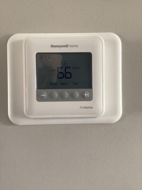 Performed scheduled preventative maintenance on Heil furnace system. Inspected all components including thermostat (Honeywell Home ProSeries), filter housing, and water treatment system. System operating normally with thermostat reading 66°F; no issues identified during routine heating tune-up.