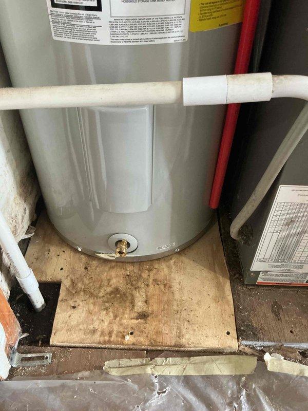 Successfully installed a new tank water heater in utility area, including proper connection of hot and cold water lines with PEX piping. Replaced existing valves and secured unit on wooden platform, ensuring all connections were properly sealed and operational.