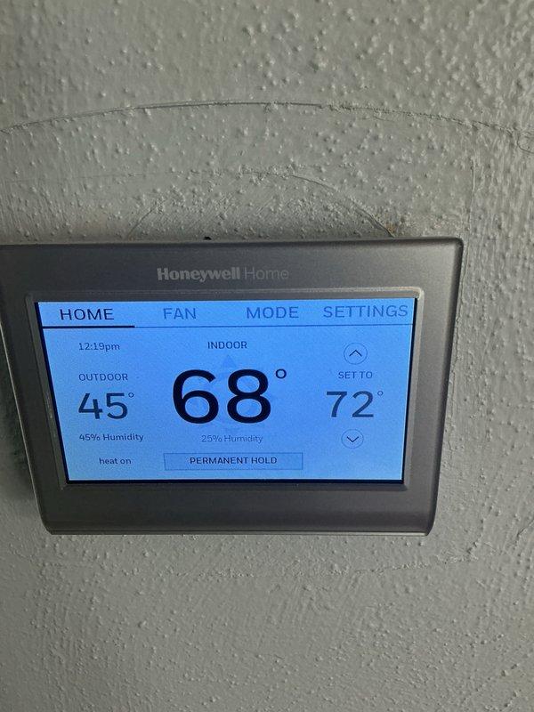 Performed basic monthly maintenance on CCH unit. Verified thermostat functionality - confirmed system holding at 68° with heat operating normally. Thermostat display showing proper indoor/outdoor temperature readings and humidity levels. Filter replacement (16x25x4) not included in this service visit.