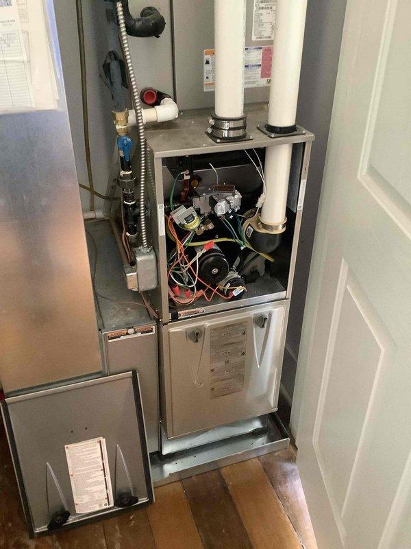 Upon arrival, diagnosed furnace with active manufacturer warranty that had ceased producing heat despite functioning pump. Visual inspection of internal components revealed issues with circuit board and wiring connections. Serviced unit by repairing electrical connections and restoring proper operation of heating system.