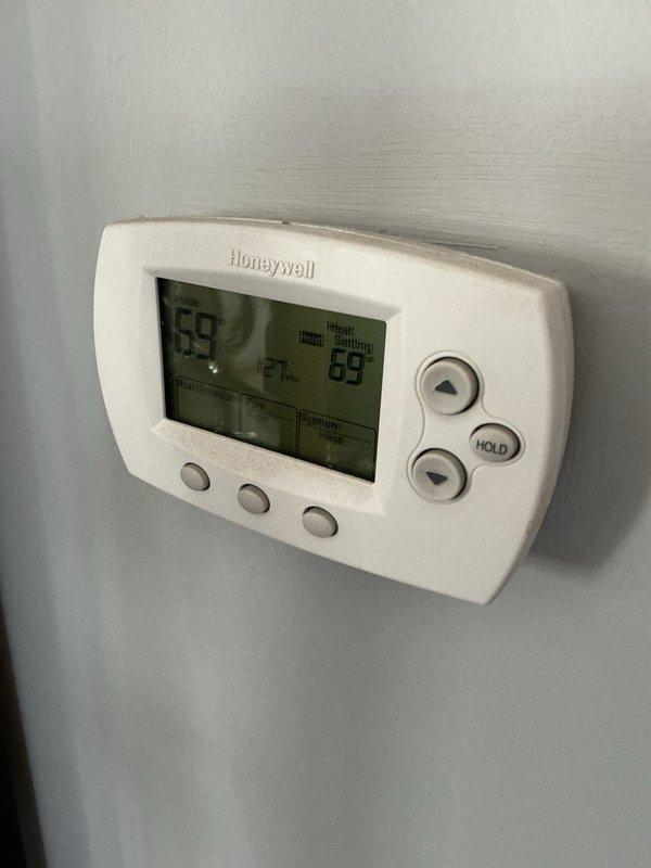 Performed annual heating system maintenance service. Checked Honeywell thermostat operation, confirming proper temperature display and control functionality. Customer was notified of potential late arrival; maintenance contract renewal scheduled for 6/25/26 (20x25x4 filter not included in service).