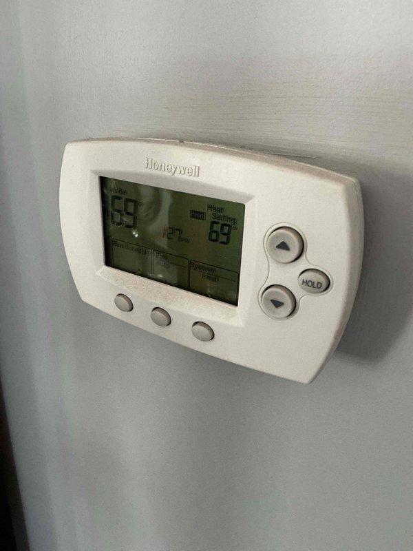 Performed annual heating system maintenance service. Checked Honeywell thermostat operation, confirming proper temperature display and control functionality. Customer was notified of potential late arrival; maintenance contract renewal scheduled for 6/25/26 (20x25x4 filter not included in service).