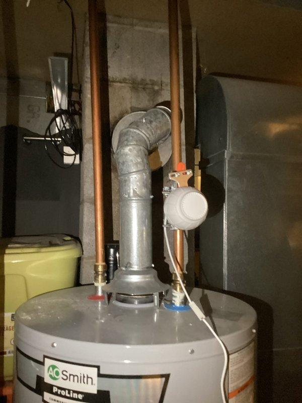 Completed monthly plumbing inspection of residential water heater system (AO Smith ProLine model) and associated plumbing components. Verified proper ventilation through galvanized metal vent pipe, checked all copper supply lines for leaks, and confirmed pressure gauge reading of approximately 20 psi, which is within normal operating parameters.