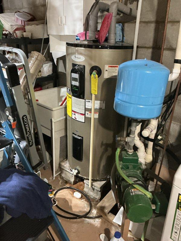 Performed monthly maintenance service on heating system as part of CCH Basic Plus plan. Inspected air filtration system with 20x20x4 filter (not included in service) and noted filter showing normal wear with slight discoloration. Examined water heater installation including expansion tank, circulation pump, and associated plumbing connections - all components functioning properly with no leaks detected.