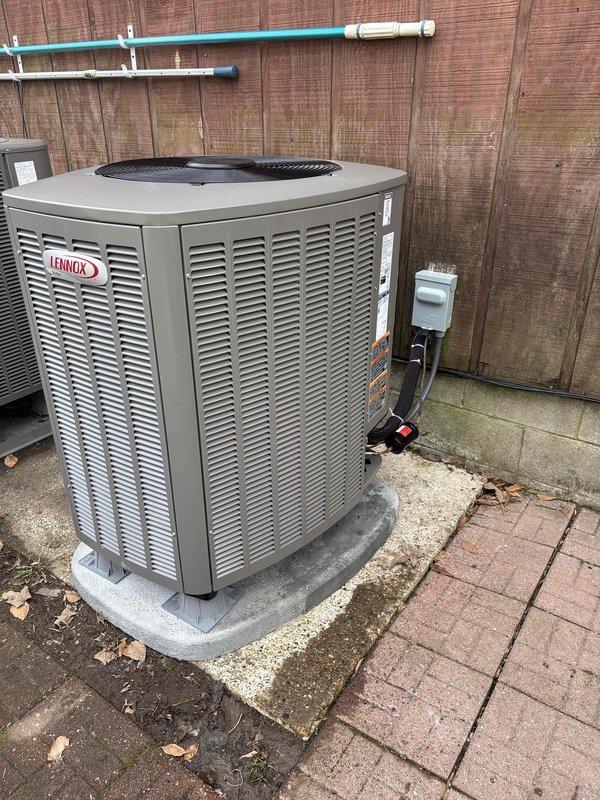 Completed installation of a Lennox heat pump system with new electric water heater. Temperature testing confirmed proper operation with supply air reaching 145.5°F. Outdoor unit was properly mounted on concrete pad with appropriate electrical disconnect and line set connections installed according to manufacturer specifications.