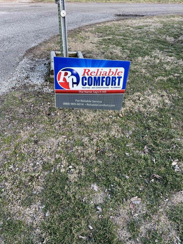 Completed installation of a new Lennox AC and gas furnace system. Verified proper system operation with temperature readings showing 49.9°F using Klein Tools digital thermometer ET10. Installed Reliable Comfort yard sign upon completion of the job.