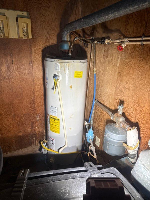 Responded to a no-water service call at a foreclosure property. Installed a new gas water heater with proper venting, expansion tank, and shutoff valve connections. Additionally, replaced a toilet in the bathroom, ensuring proper installation of the new fixture with all necessary components.