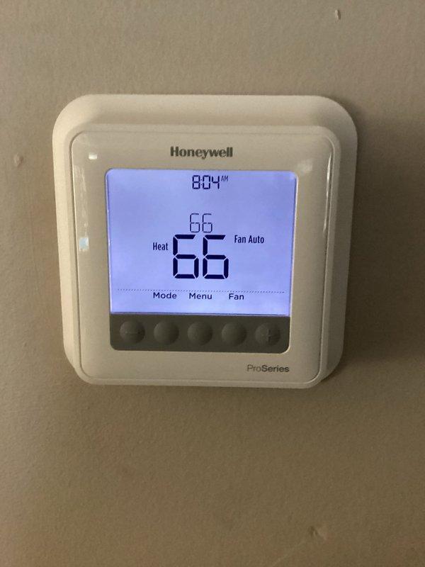 Performed monthly maintenance service on heating system. Inspected digital Honeywell ProSeries thermostat, verified proper operation in Heat mode with temperature set at 66°F. Checked water heater connections and piping for proper installation; no leaks detected. Customer will need to replace 16x25x4 filter (not included in service).