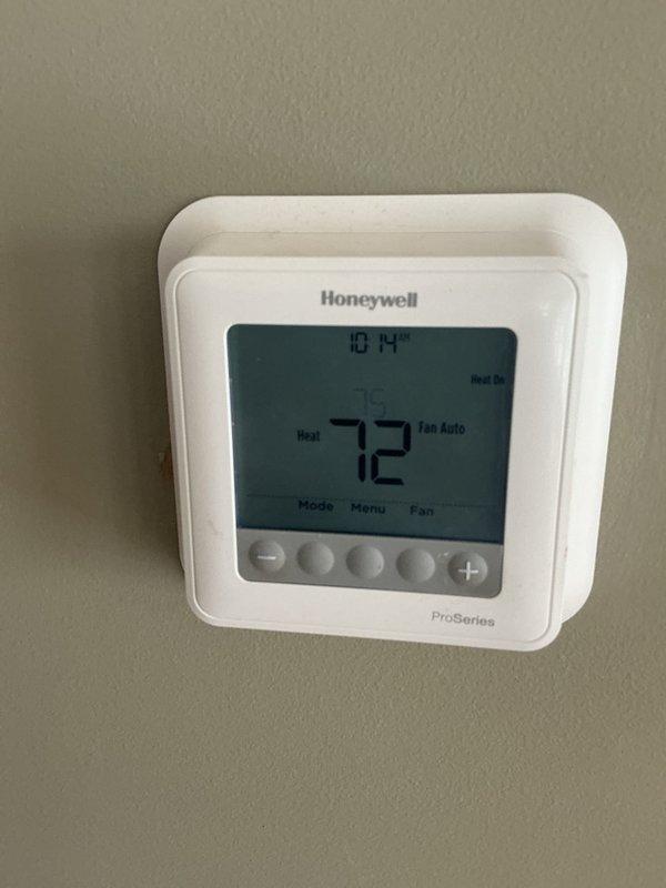 Performed rescheduled basic monthly maintenance on heating system. Inspected Honeywell ProSeries thermostat (set to 72°F in Heat mode) and exterior unit, which was properly positioned on concrete pad. Customer requested estimate for duct cleaning due to dust/dirt accumulation in return vents.