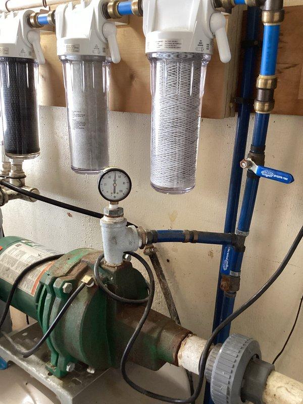 Diagnosed water leak under home as requested. Located rusted galvanized pipe fitting that had failed, causing the leak. Removed damaged fitting and replaced with new brass ball valve, reconnecting to existing water filtration system. Tested system after repair, confirmed proper operation with no leaks present.