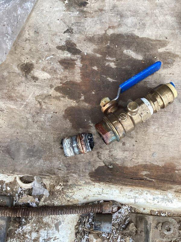 Diagnosed water leak under home as requested. Located rusted galvanized pipe fitting that had failed, causing the leak. Removed damaged fitting and replaced with new brass ball valve, reconnecting to existing water filtration system. Tested system after repair, confirmed proper operation with no leaks present.