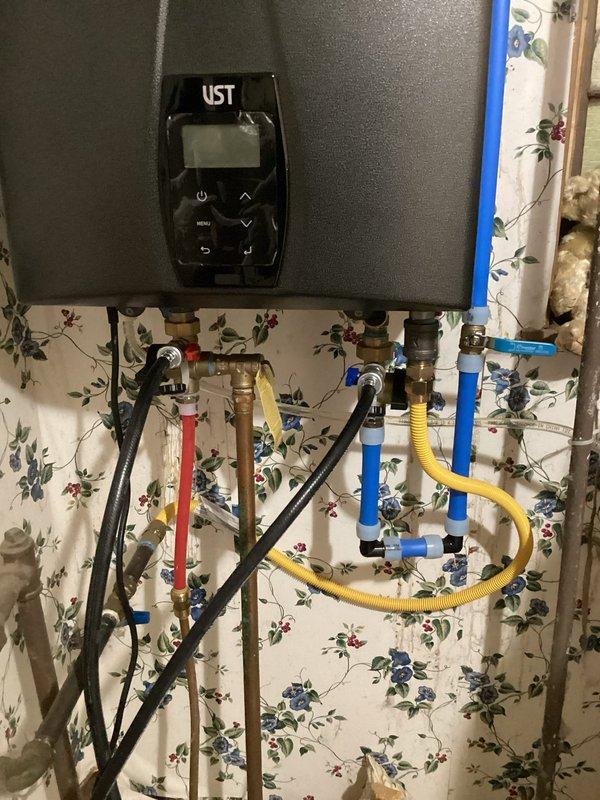 Responded to service call for kitchen plumbing issues following dishwasher installation. Installed shutoff valve for dishwasher and restored cold water supply to kitchen sink. Performed scheduled maintenance flush on tankless water heater system, inspecting all connections and ensuring proper function of supply lines.
