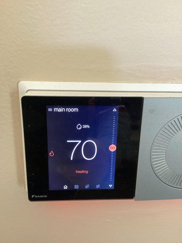 Performed basic monthly maintenance on Daikin heating system. Inspected thermostat functionality (confirmed proper operation at 70°F with 38% humidity) and examined air filter which showed moderate dust accumulation requiring cleaning or replacement.