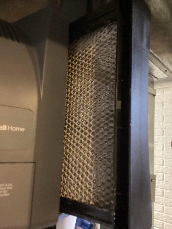 Performed basic monthly maintenance on Daikin heating system. Inspected thermostat functionality (confirmed proper operation at 70°F with 38% humidity) and examined air filter which showed moderate dust accumulation requiring cleaning or replacement.