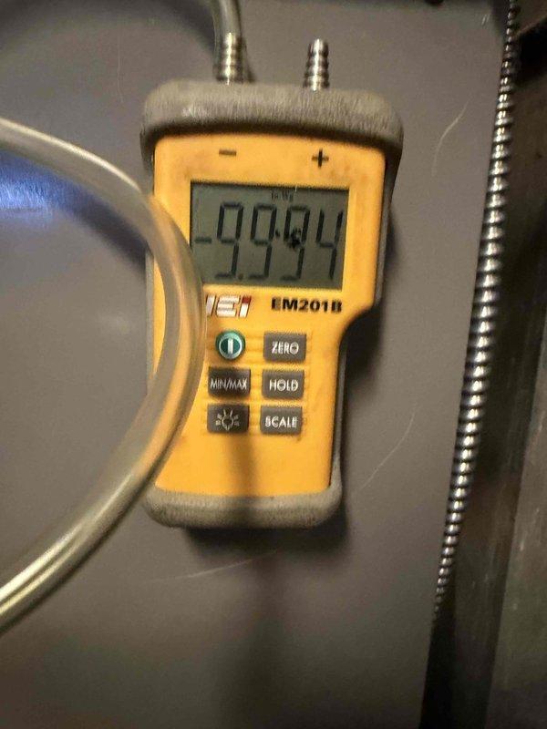 Completed installation of new Lennox AC and gas furnace system. Performed proper system startup verification with digital manometer showing 9994 reading during pressure testing, and confirmed discharge temperature of 129.9°F using UEi PDT655 pocket thermometer. All measurements within manufacturer specifications.