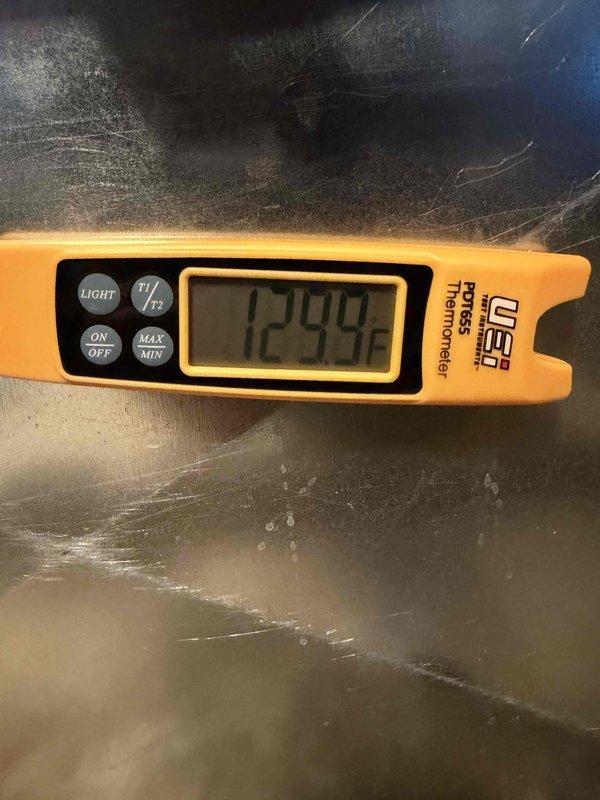 Completed installation of new Lennox AC and gas furnace system. Performed proper system startup verification with digital manometer showing 9994 reading during pressure testing, and confirmed discharge temperature of 129.9°F using UEi PDT655 pocket thermometer. All measurements within manufacturer specifications.