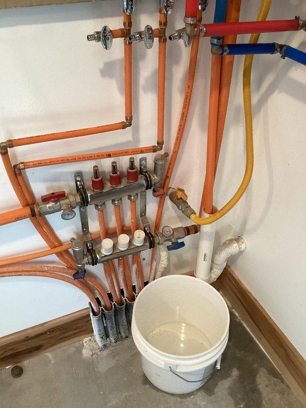 Diagnosed pressure and flow issues with Navien tankless water heater system. Inspected internal components including circuit boards and electronic systems. Evaluated PEX piping network and manifold distribution system, finding restriction in flow due to sediment buildup. Flushed system to remove accumulated debris and restore proper operation.