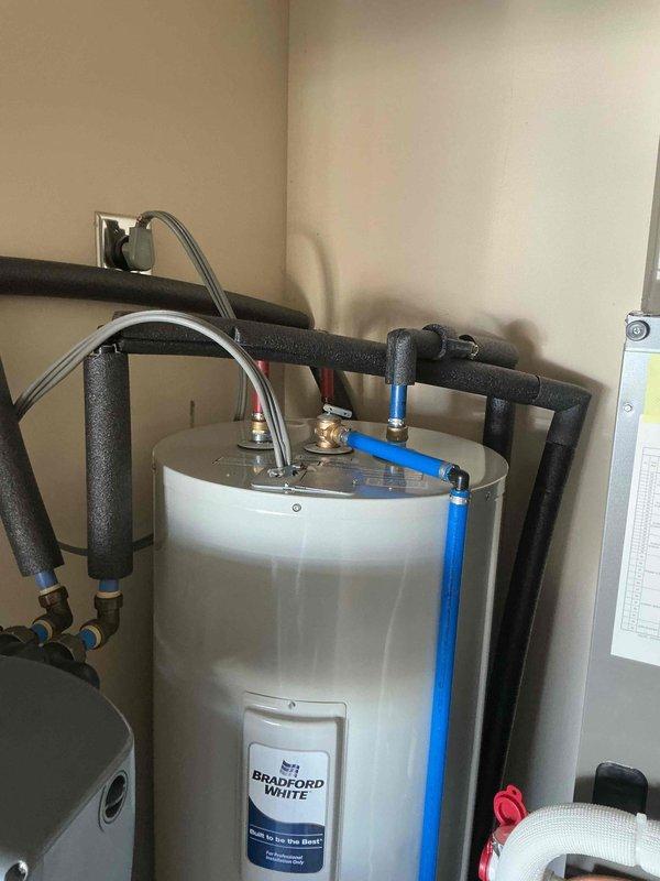 Successfully installed a 50-gallon Bradford White tanked water heater in utility area as requested. Completed all necessary plumbing connections including PEX supply lines with proper insulation on pipes. System was properly secured, connected to existing electrical, and verified to be functioning correctly before completion.