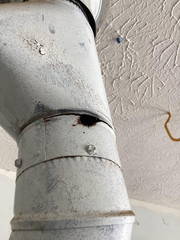 Diagnosed system blowing cold air when set to heat; discovered customer's recently self-installed thermostat had incorrect wiring resulting in -23.6°F supply air temperature. Corrected thermostat connections and verified proper heat cycle operation. Noted condensation and minor deterioration on refrigerant piping that should be monitored but is not currently affecting system performance.