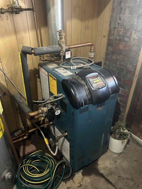 Diagnosed and identified a malfunctioning high temperature limit switch/sensor on the blue residential boiler system. Documented the current condition of the system with detailed photos, noting the issue affects water temperature. Customer was not present during inspection; repair options are pending approval.